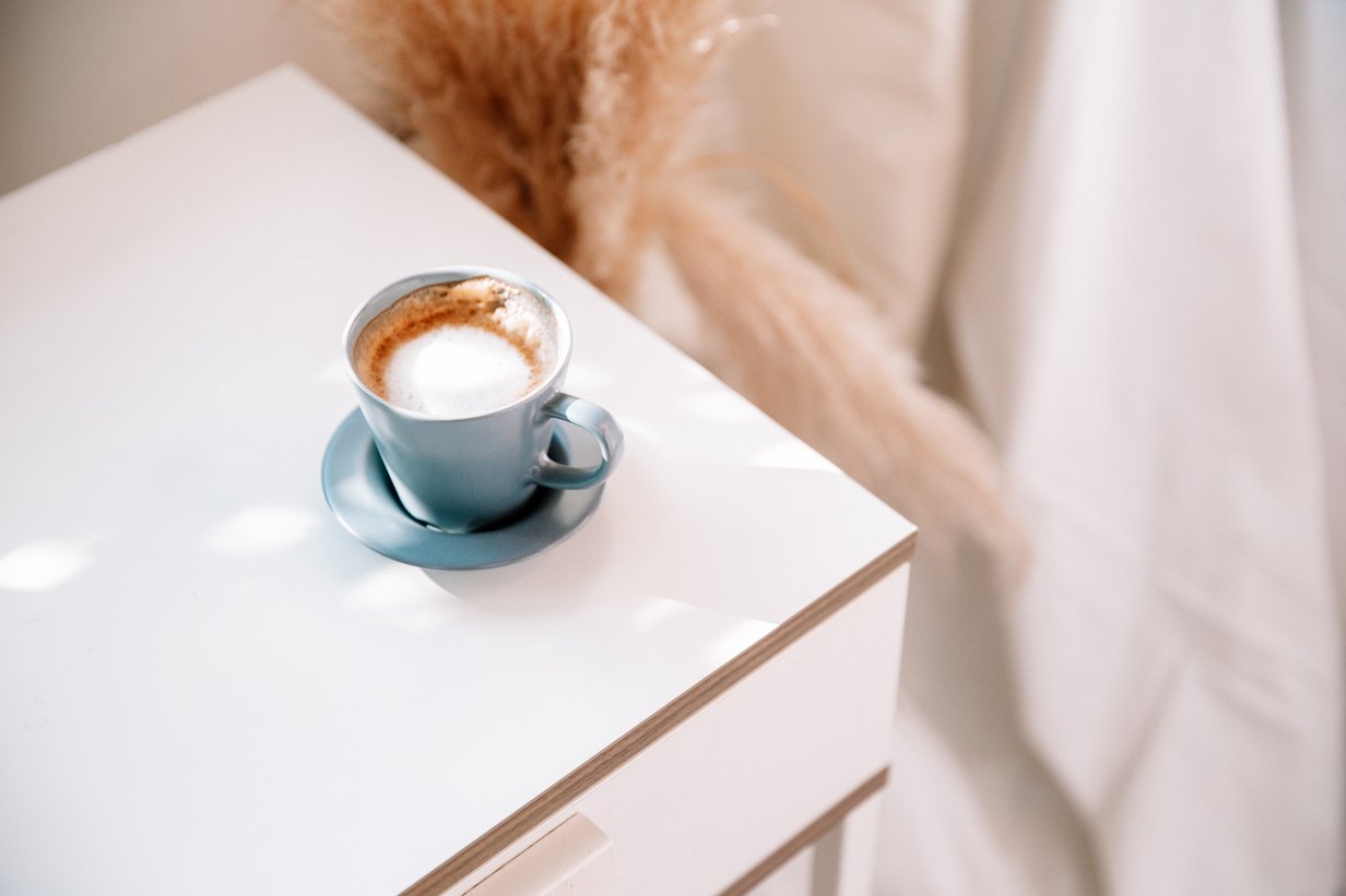 Cup of Coffee on a Bedside Table